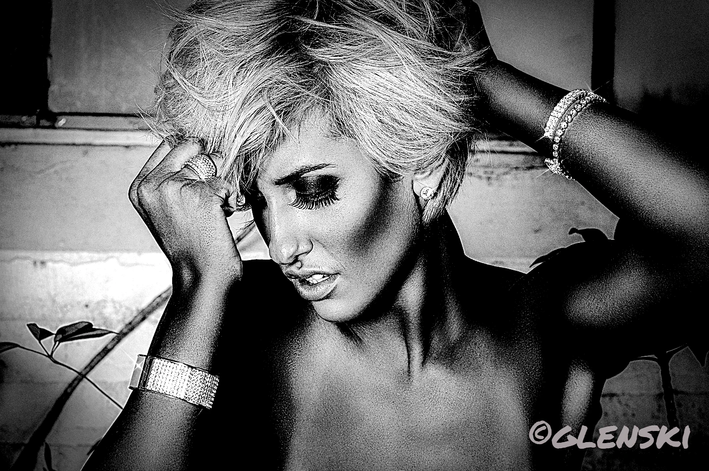 Black and white studio portrait with signature watermark, Watermark Gienie output