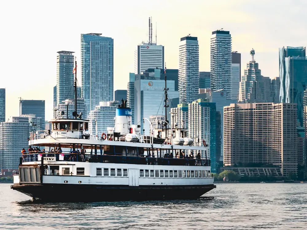 Toronto harbour ferry crossing in front of the downtown skyline